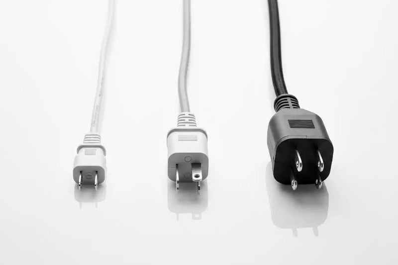 Three electrical plugs showing popcorn machine wattage.