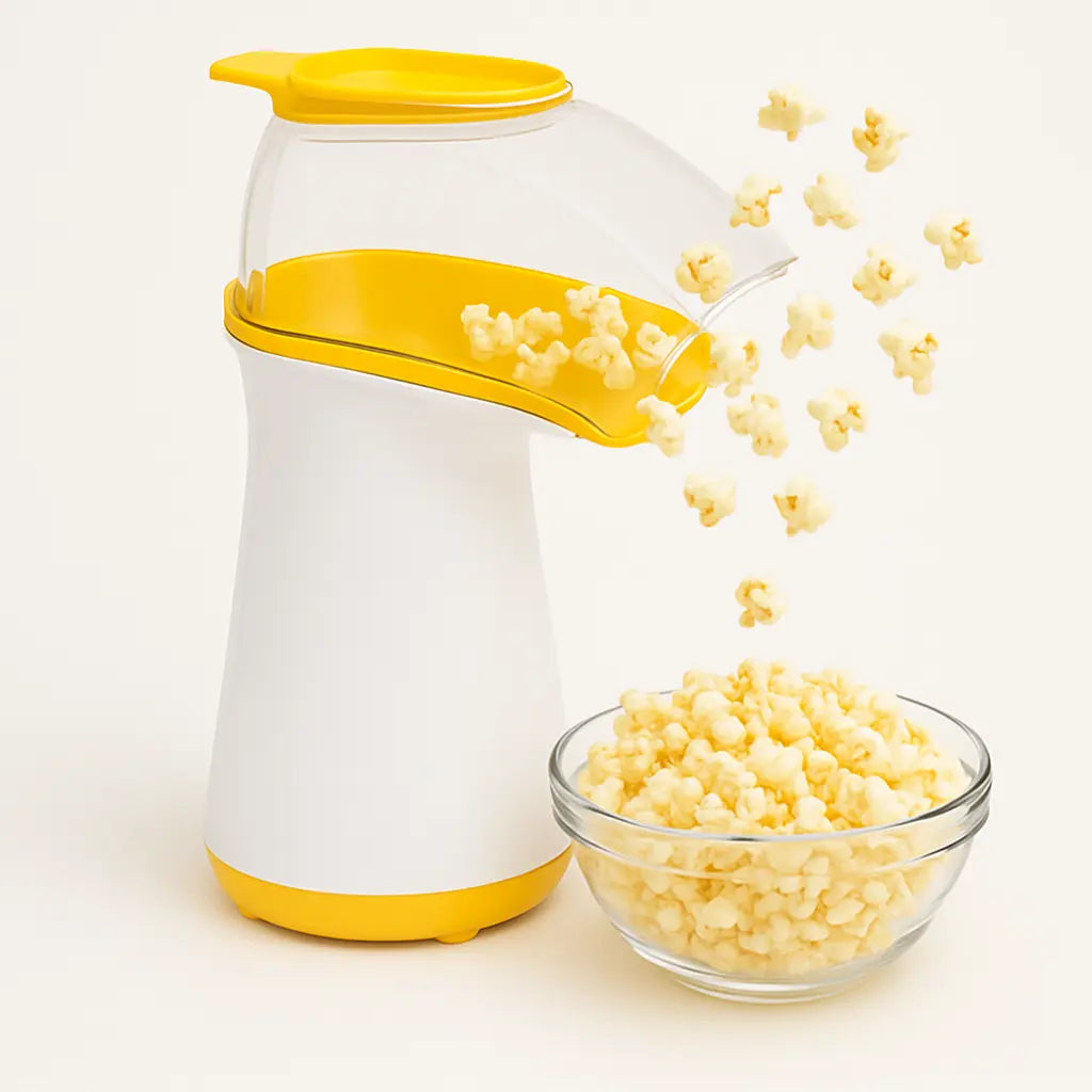 Air pop popcorn popper with yellow accents dispensing popcorn into a glass bowl.