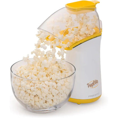 Air pop popcorn popper with white popcorn spilling into a glass bowl.