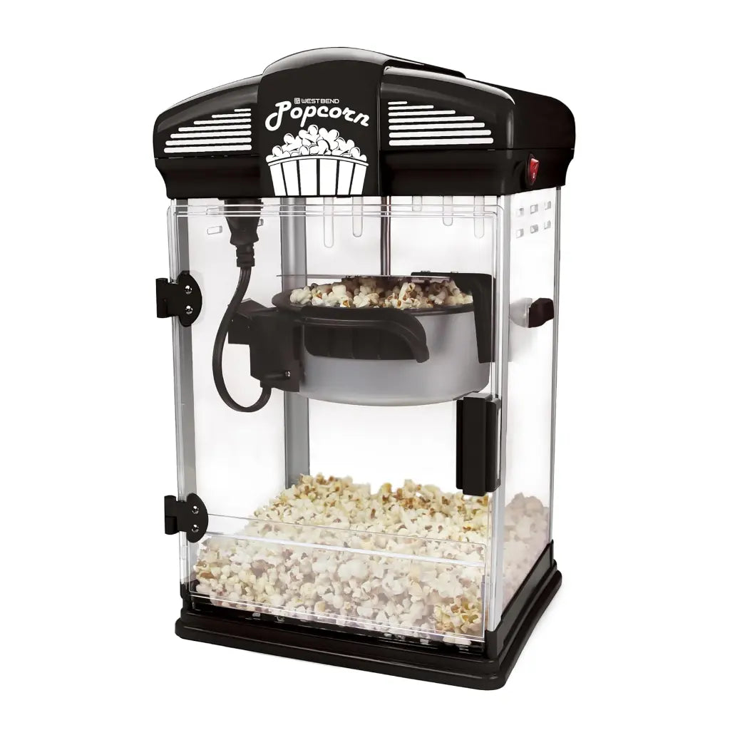Black popcorn popper machine  with popped popcorn inside.
