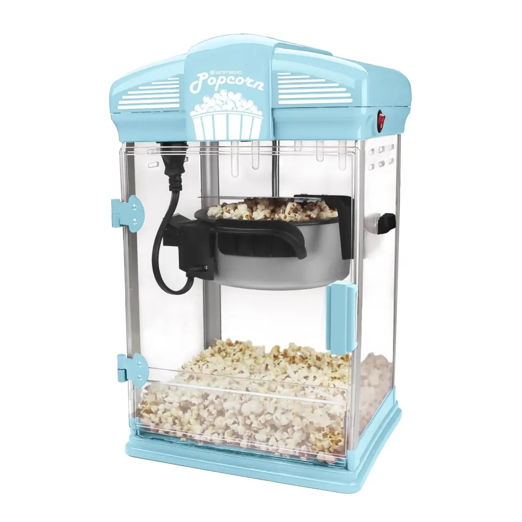 Light blue popcorn popper machine  with popped popcorn inside.