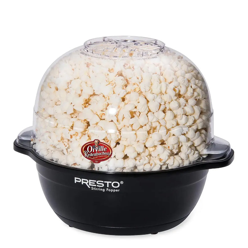 Hot oil popcorn popper with popcorn inside.