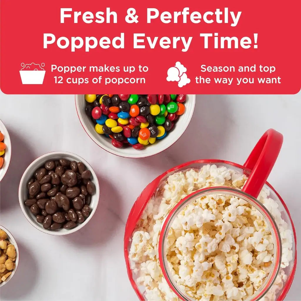 Microwave popcorn popper with popcorn and bowls of candies.