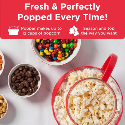 Microwave popcorn popper with popcorn and bowls of candies.