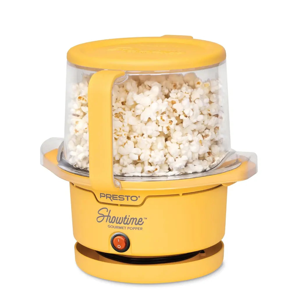 Oil popcorn popper with popped popcorn inside.