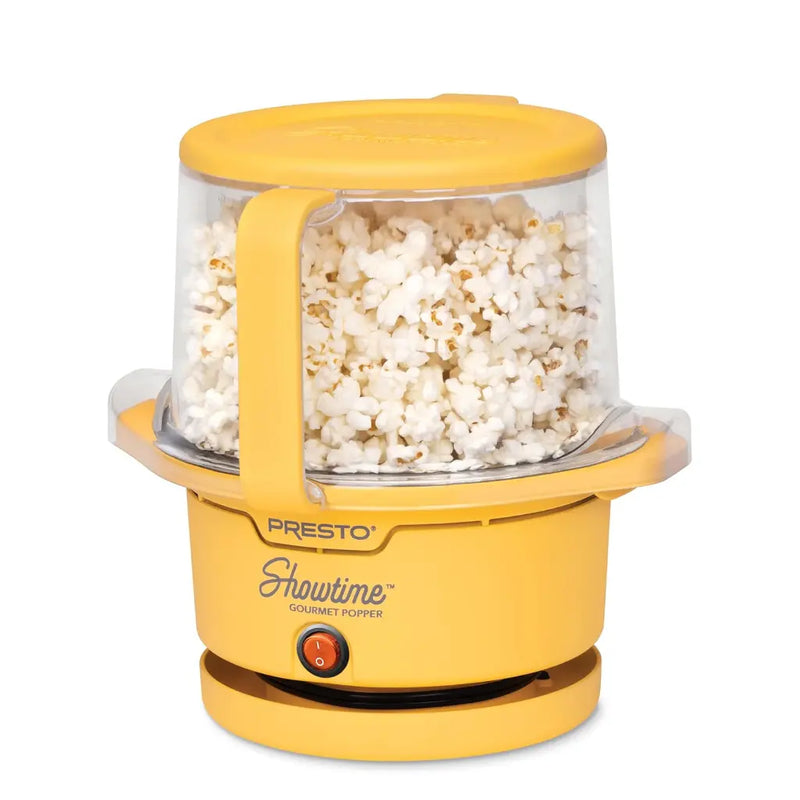 Oil popcorn popper with popped popcorn inside.