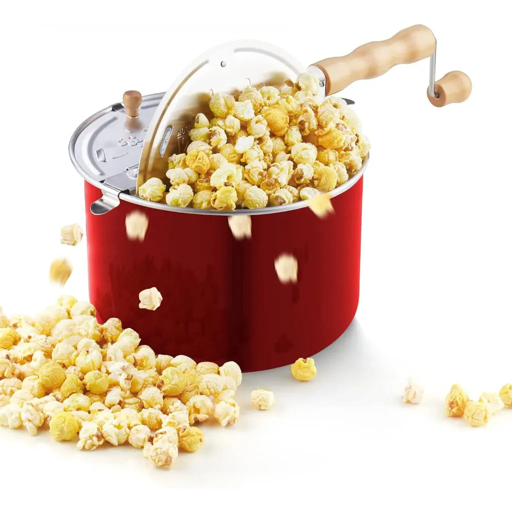 Red stovetop popcorn popper with popped popcorn.