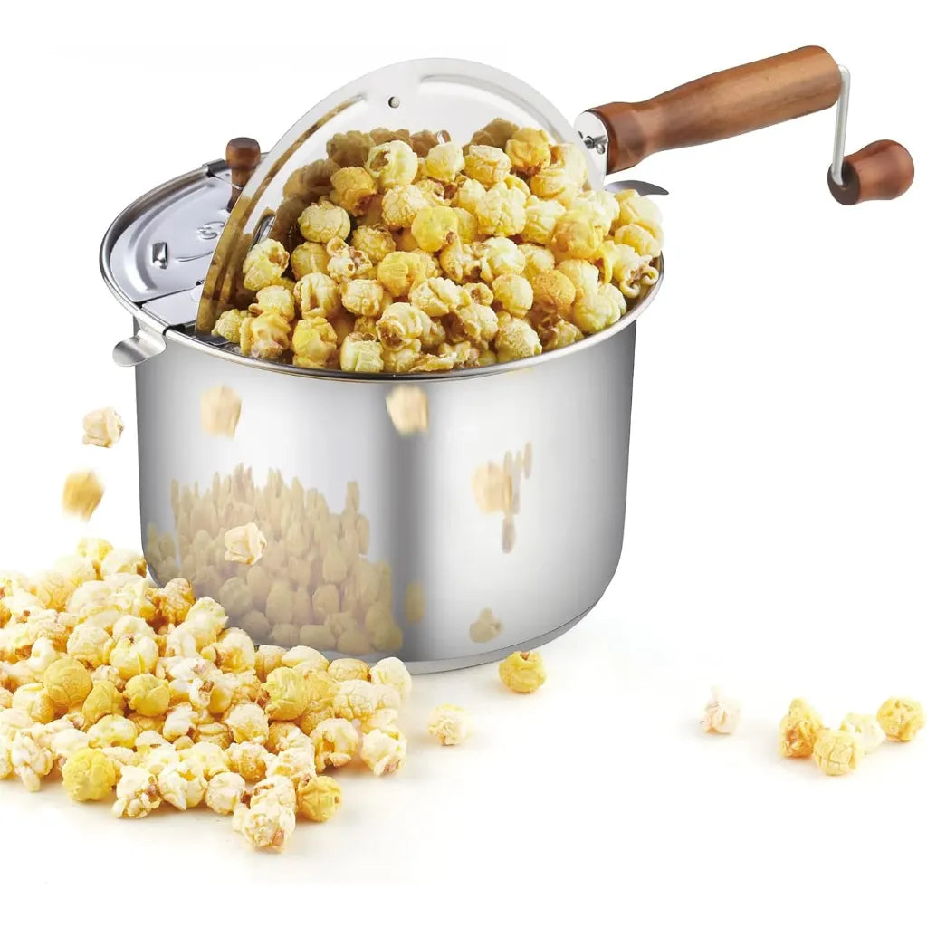 Stainless steel stovetop popcorn popper with wooden handle filled with popcorn.