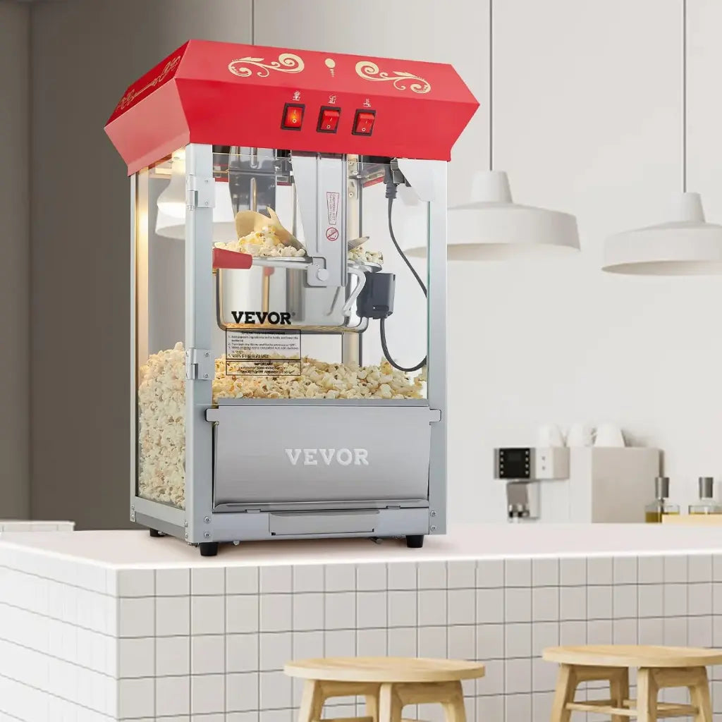 Theater popcorn machine in a kitchen with white tiled walls and wooden stools.