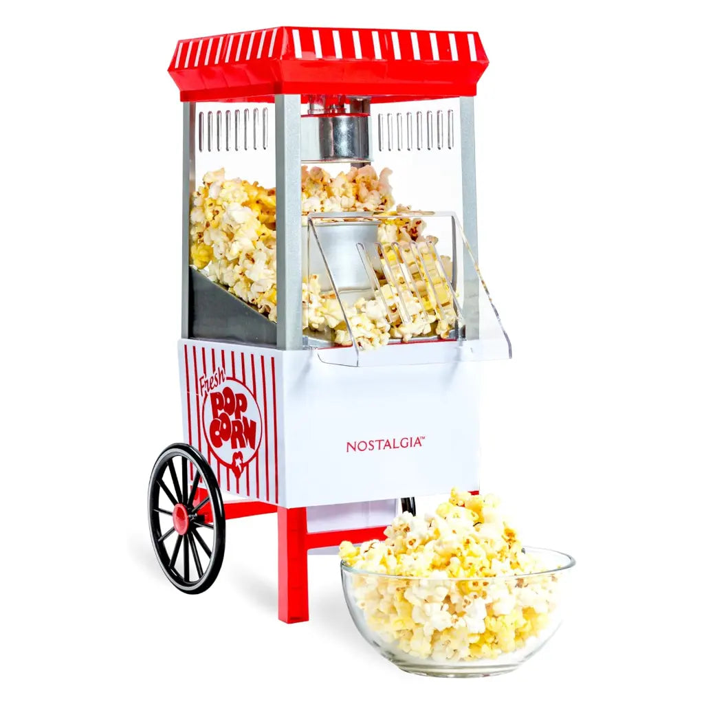 White and red air pop popcorn machine with a bowl of popcorn.